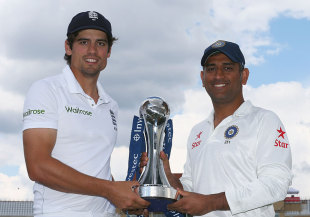 dhoni withe trophy