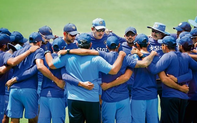 Dhoni in a huddle