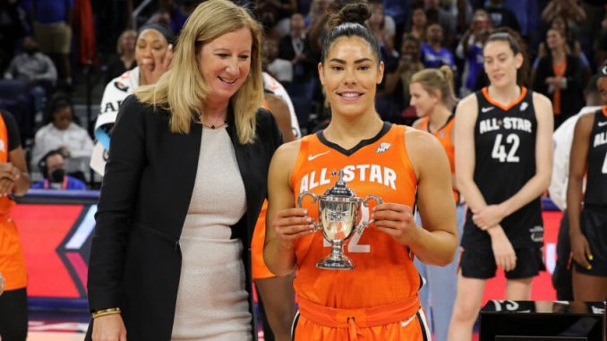 CHICAGO, ILLINOIS - JULY 10: Kelsey Plum #10 of Team Wilson is presented with the MVP trophy during the 2022 AT&T WNBA All-Star Game at the Wintrust Arena on July 10, 2022 in Chicago, Illinois. (Photo by Stacy Revere/Getty Images)