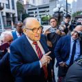 Man charged with assault for tapping Giuliani on the back signals potential $2m lawsuit for false arrest