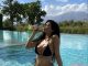Photos: Kylie Jenner Is Absolute Fire in a Black String Thong Bikini