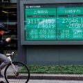 Asian equities rise, dollar sways as focus firmly on Fed minutes