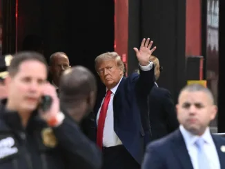 Trumps lands in New York for surrender, opposes TV cameras in court