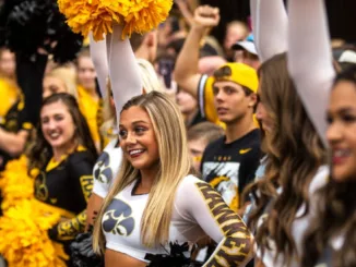 Watch: Iowa Cheerleader's Viral End-Zone Flip Wardrobe Malfunction