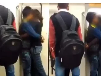 Couple Spottted Kissing And Cuddling Up Near The Automated Metro Train Doors