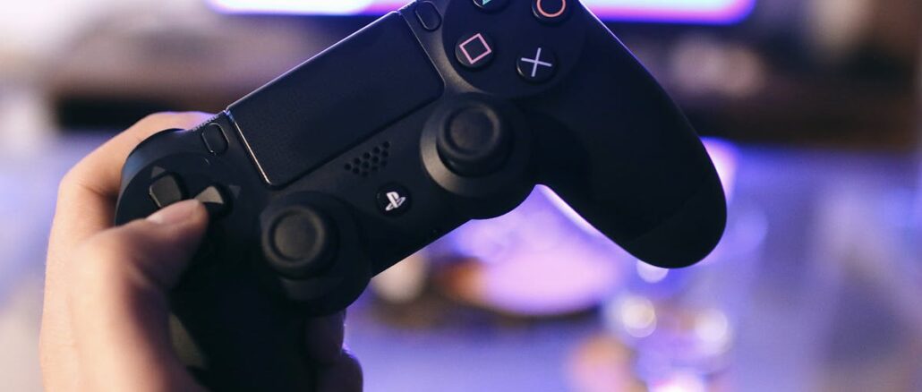 Person Holding Sony Ps4 Dualshock 4